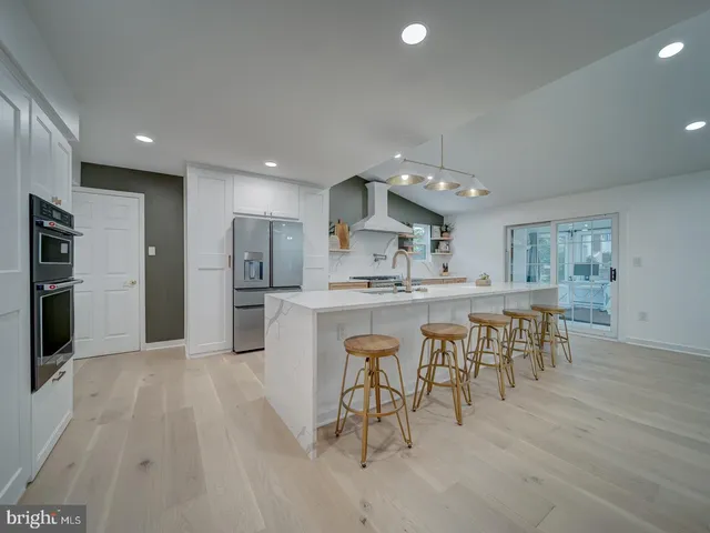 a living room with a fireplace and a flat screen tv