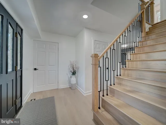 a view of a livingroom with furniture and staircase