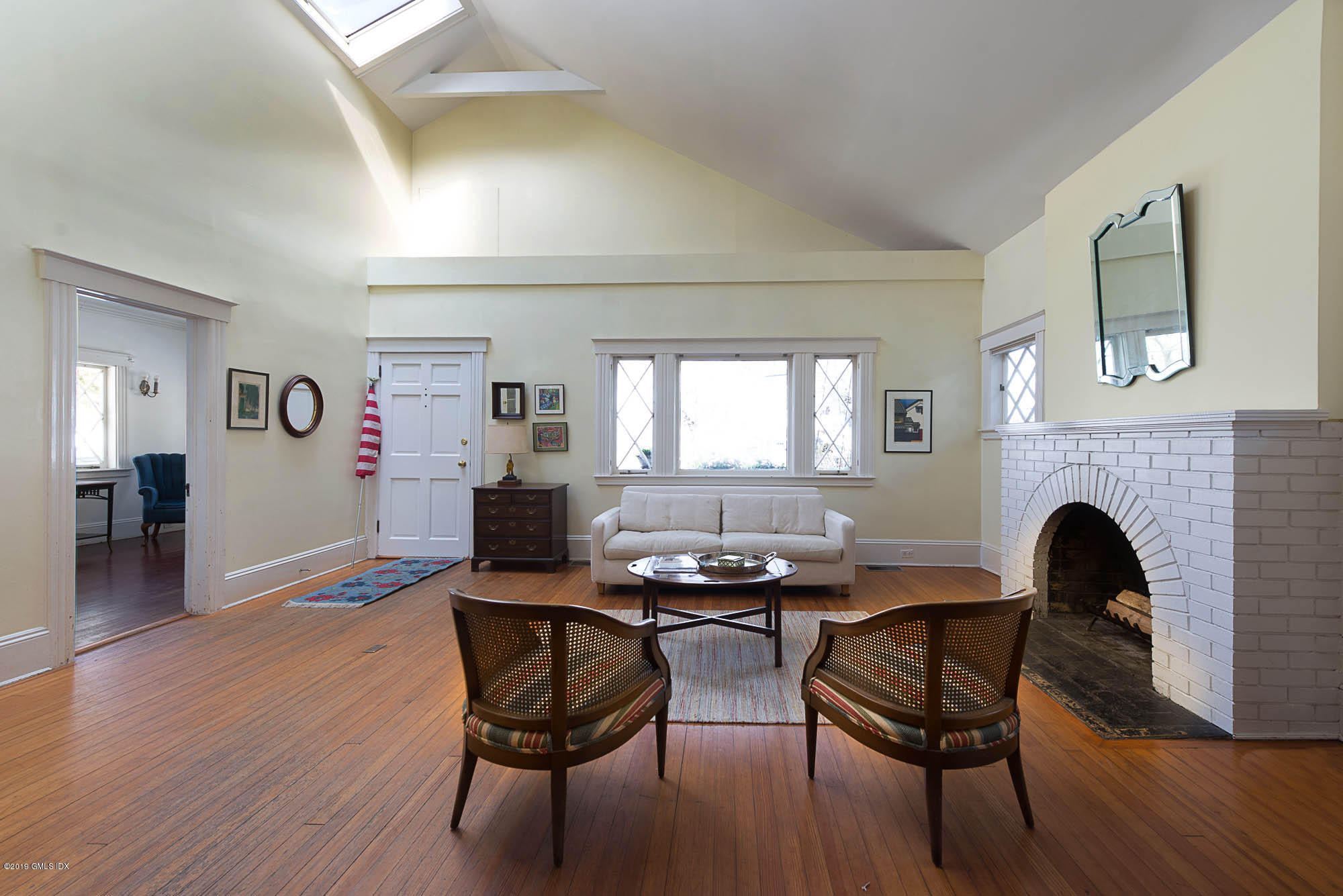28 Chapel Lane Riverside, CT 06878 - Photo 11 of 38 a living room with furniture and a fireplace