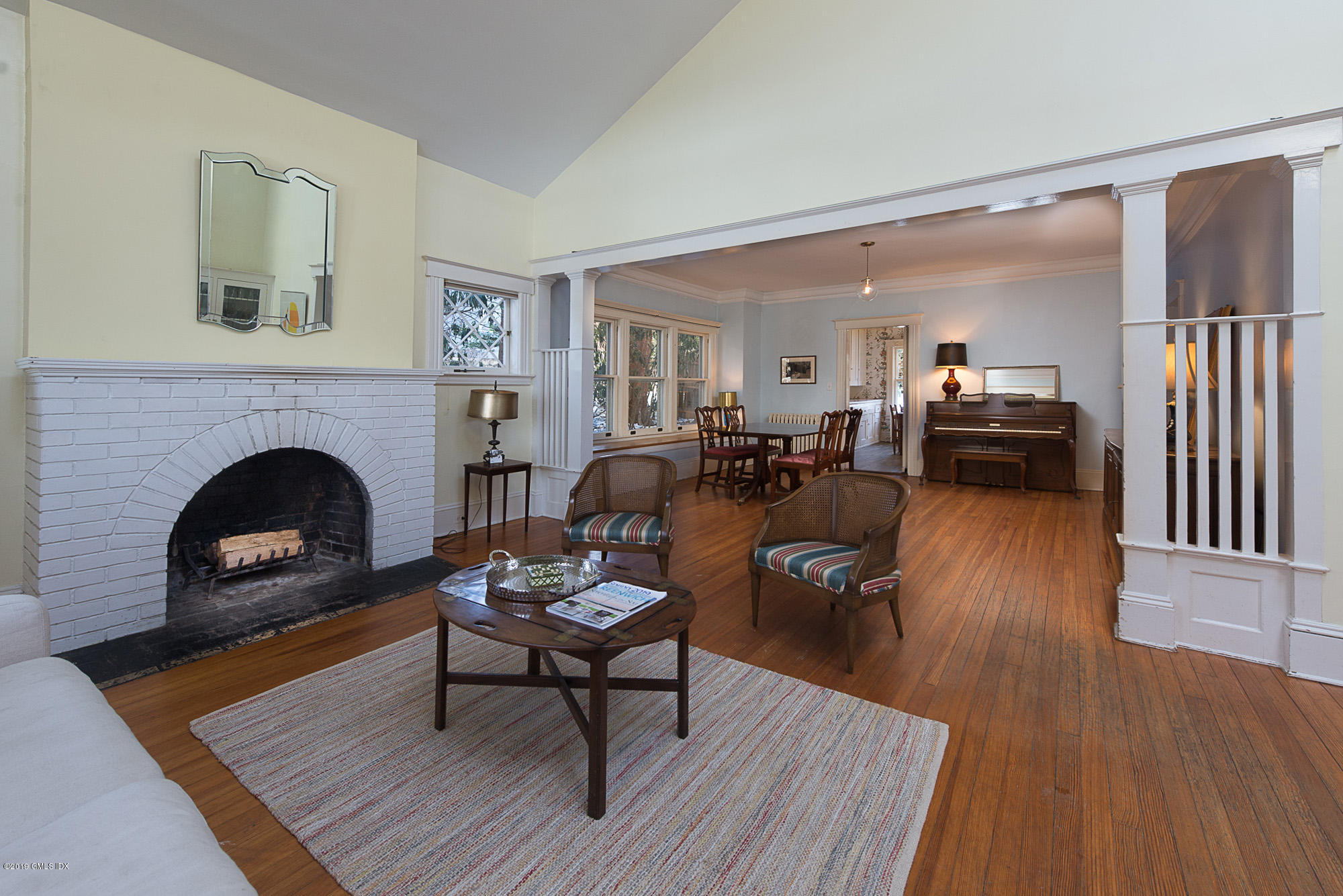 28 Chapel Lane Riverside, CT 06878 - Photo 12 of 38 a living room with furniture and a fireplace