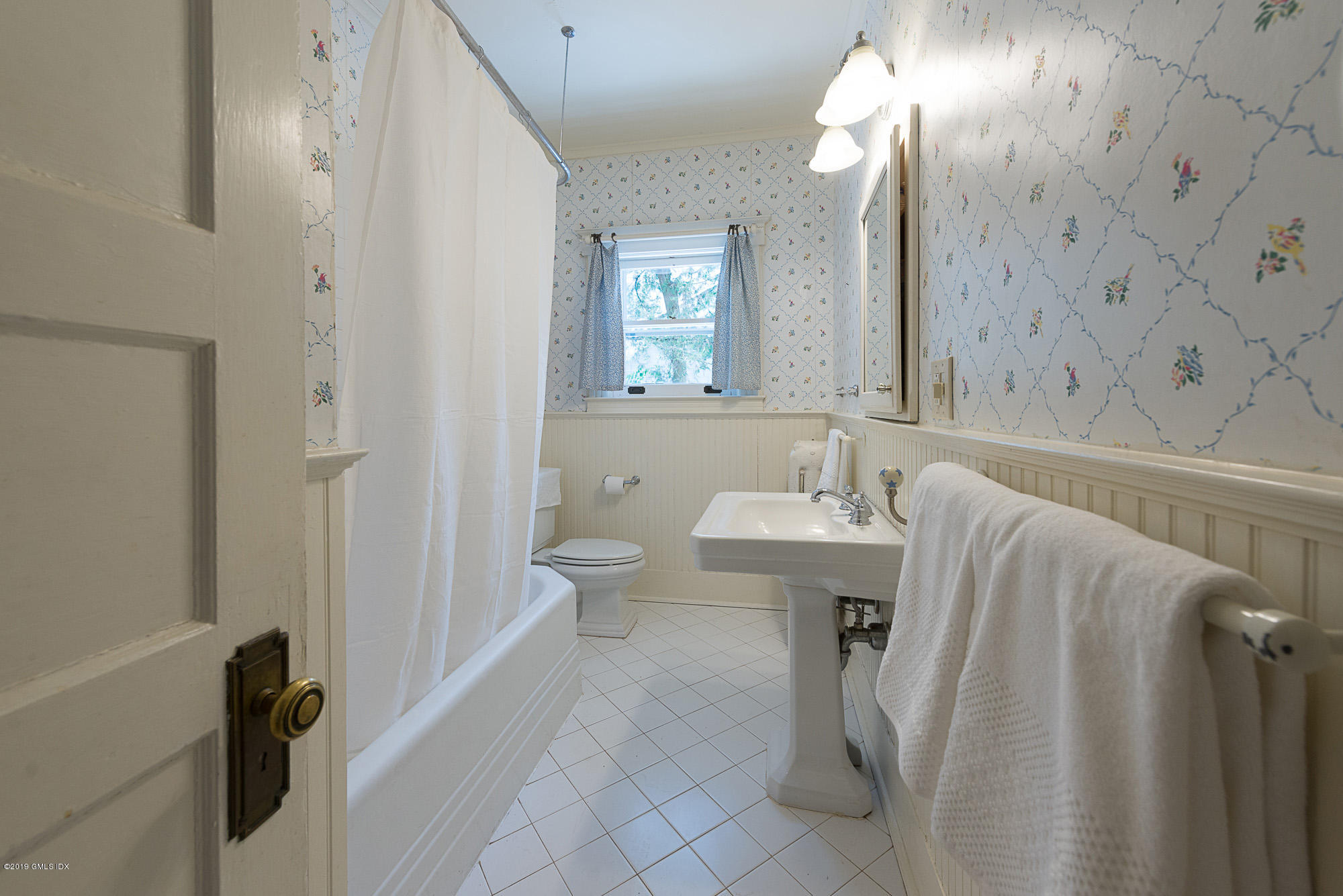 28 Chapel Lane Riverside, CT 06878 - Photo 19 of 38 a bathroom with a sink a toilet and shower