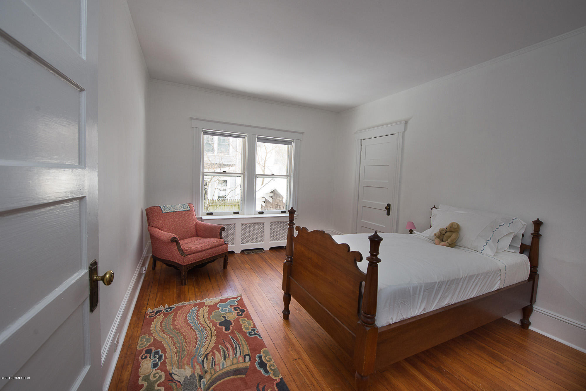 28 Chapel Lane Riverside, CT 06878 - Photo 21 of 38 a bed room with a bed and a window