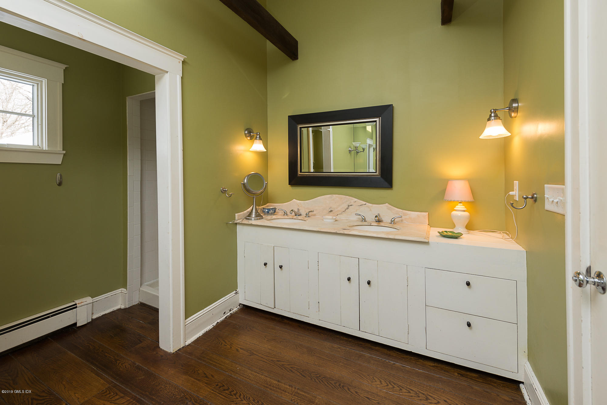 28 Chapel Lane Riverside, CT 06878 - Photo 26 of 38 a bathroom with a granite countertop sink and a mirror