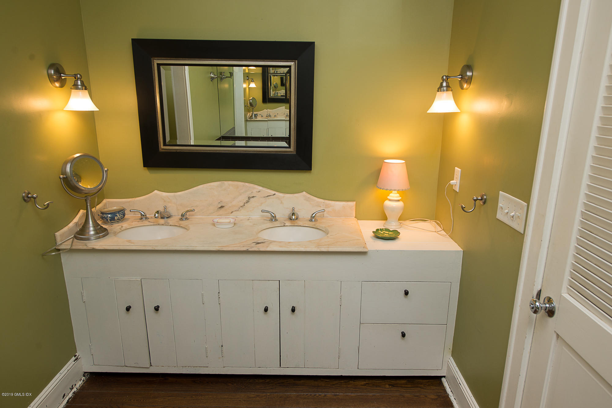 28 Chapel Lane Riverside, CT 06878 - Photo 27 of 38 a bathroom with a sink and a mirror