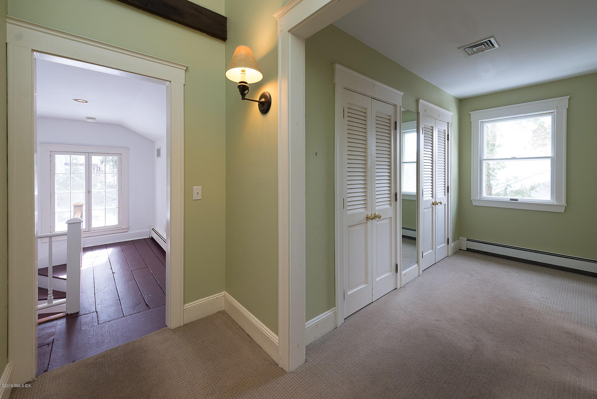 28 Chapel Lane Riverside, CT 06878 - Photo 30 of 38 wooden floor in an empty room and a window