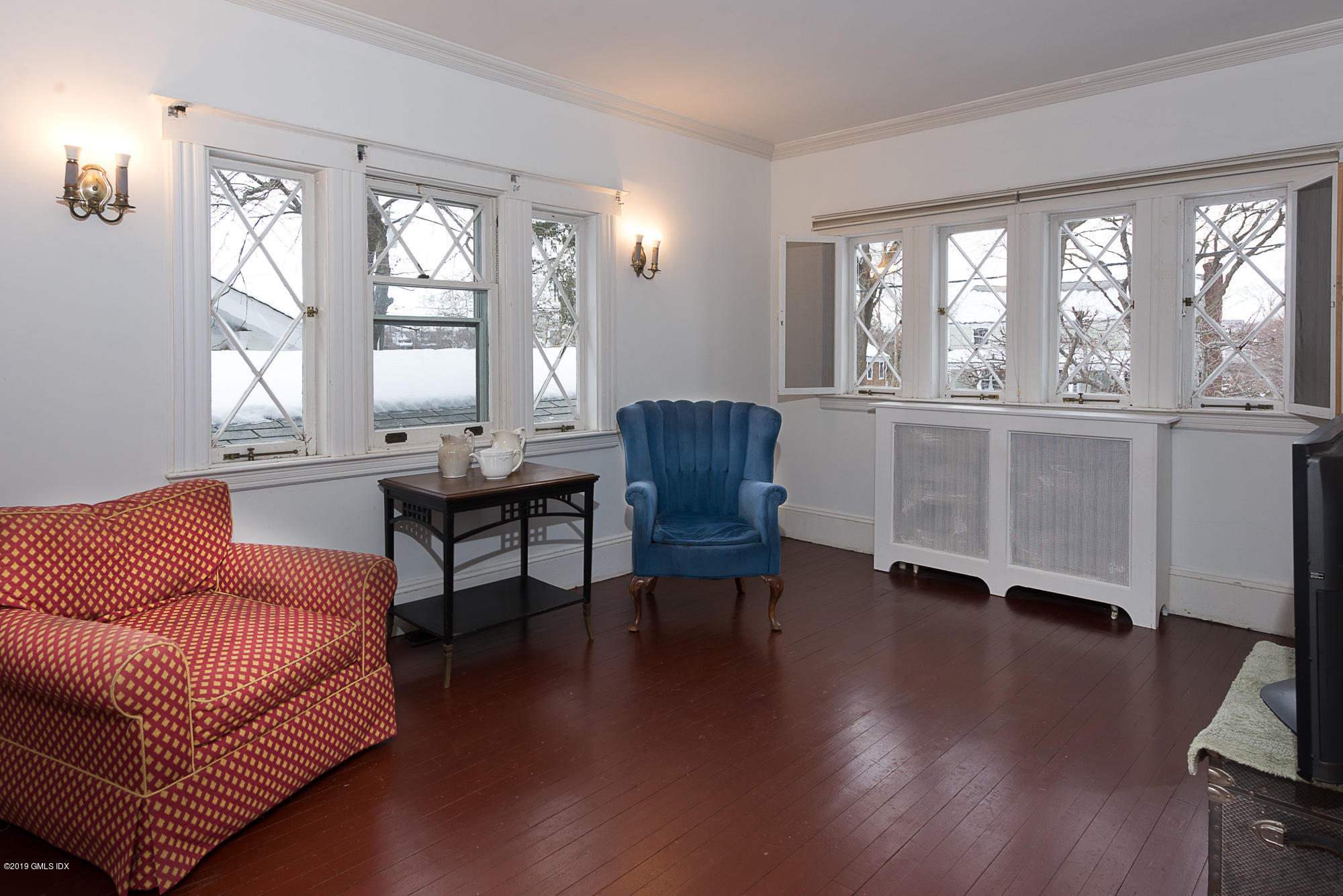 28 Chapel Lane Riverside, CT 06878 - Photo 31 of 38 a living room with furniture and a large window