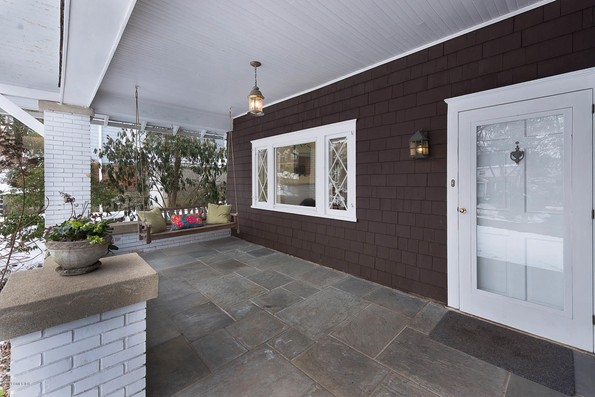 28 Chapel Lane Riverside, CT 06878 - Photo 32 of 38 a living room with furniture and a potted plant