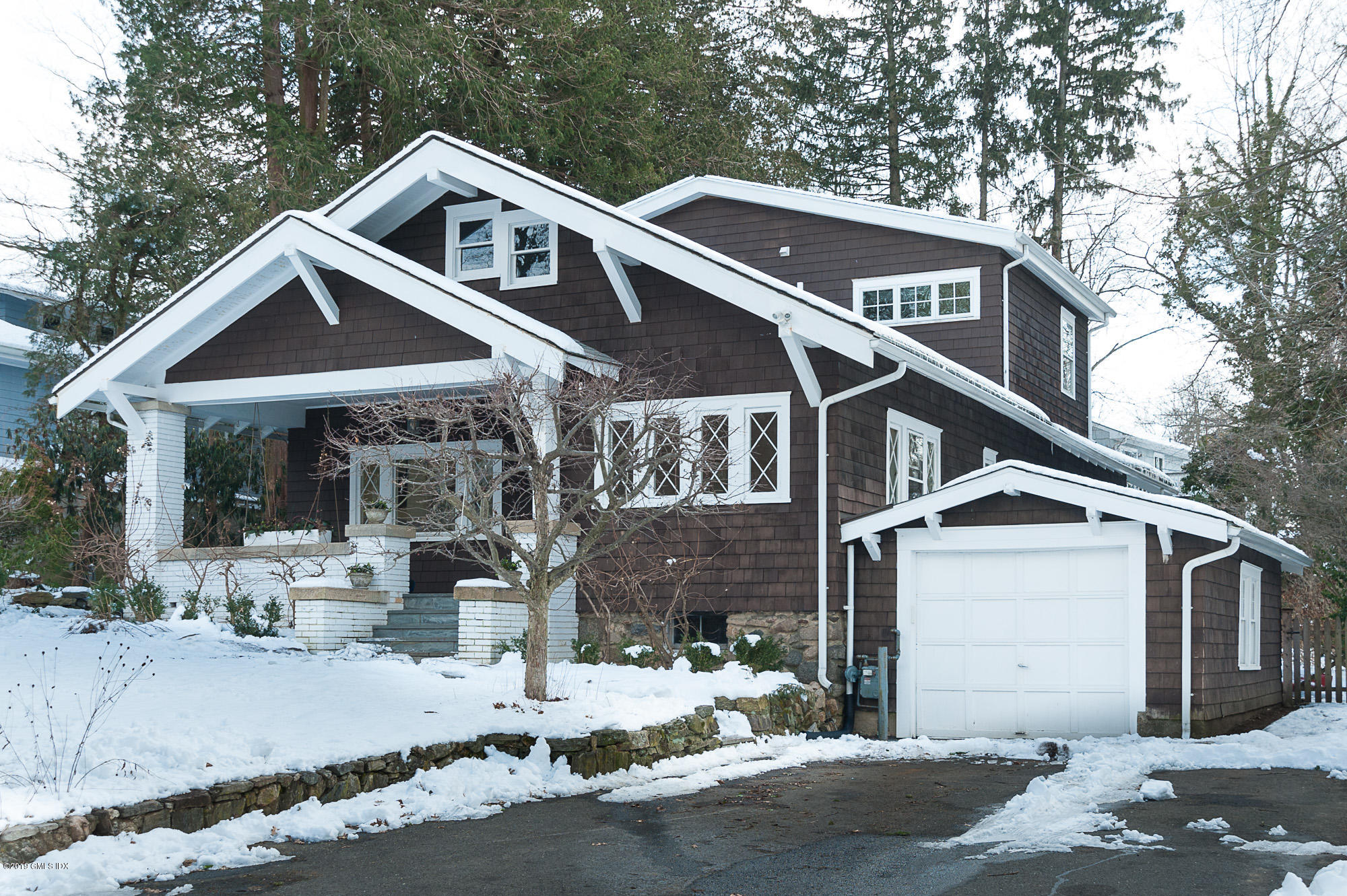 28 Chapel Lane Riverside, CT 06878 - Photo 36 of 38 a front view of a house with a yard