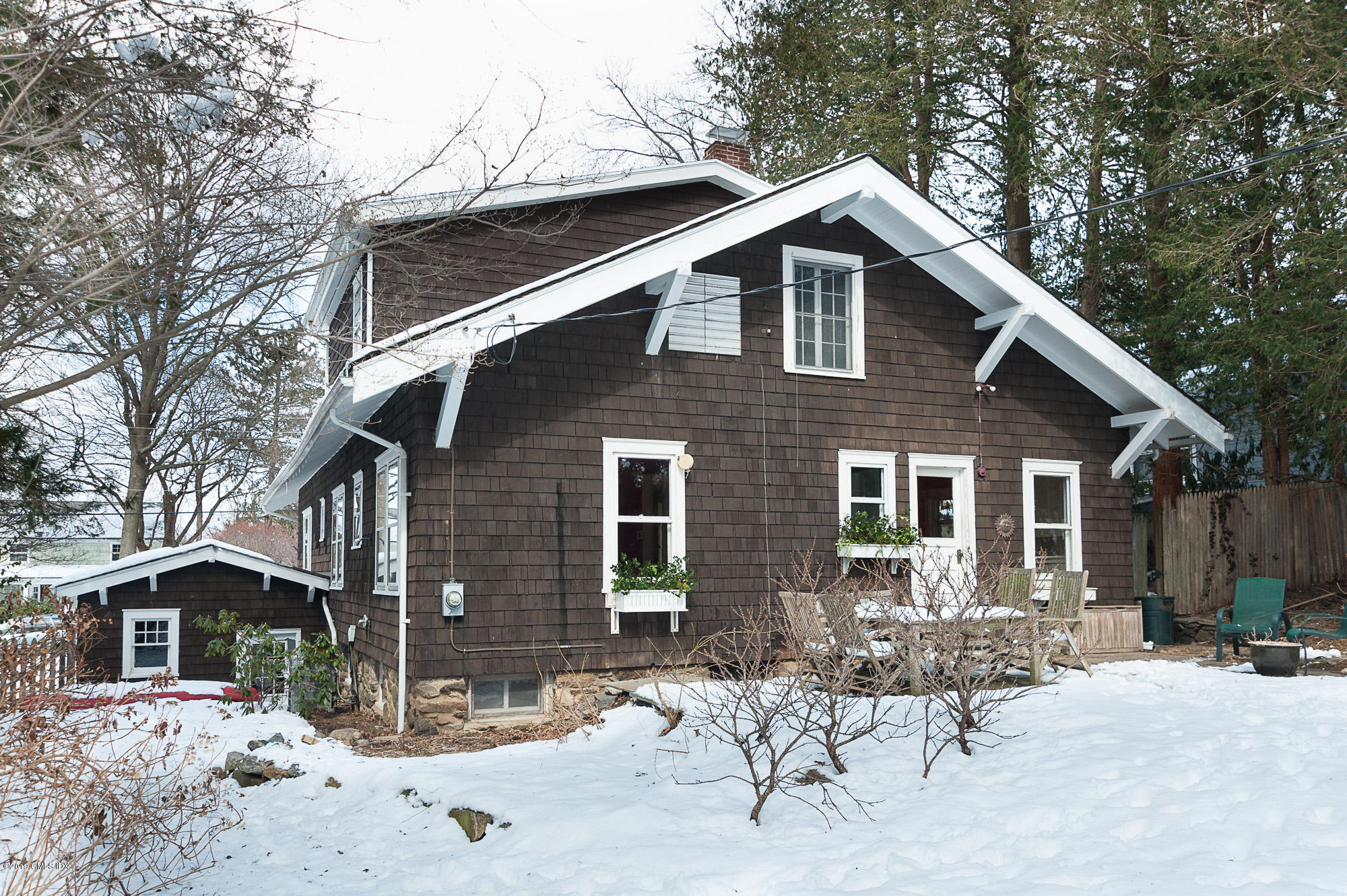 28 Chapel Lane Riverside, CT 06878 - Photo 37 of 38 a front view of house with yard and seating space