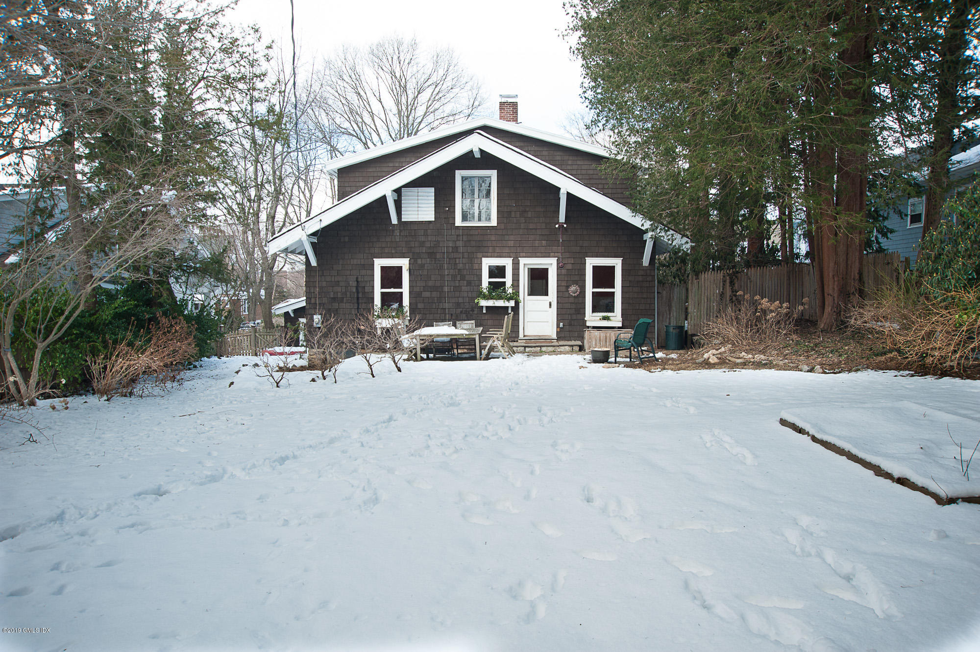 28 Chapel Lane Riverside, CT 06878 - Photo 38 of 38 a view of a house with a yard covered in snow