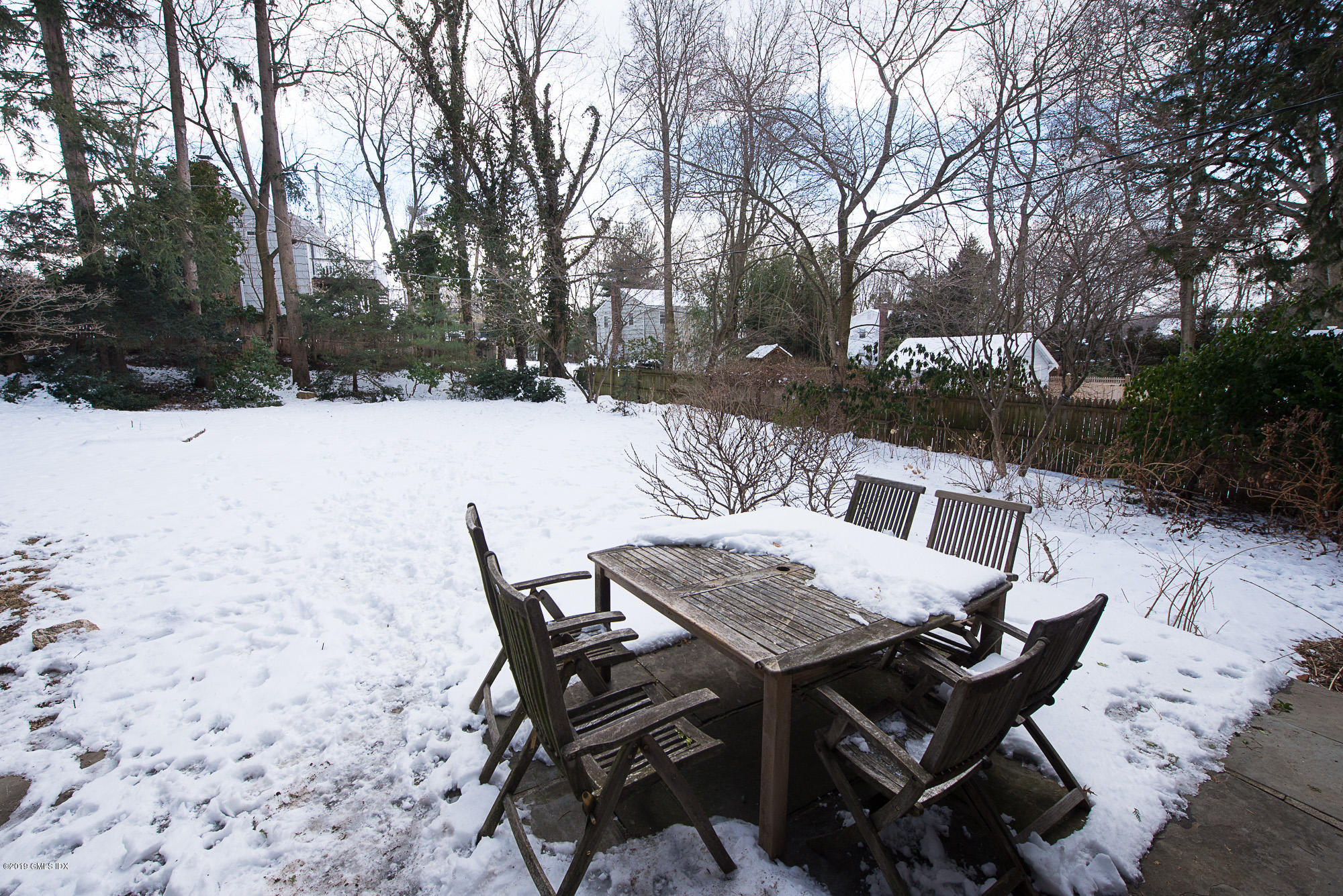 28 Chapel Lane Riverside, CT 06878 - Photo 4 of 38 a view of a backyard with furniture