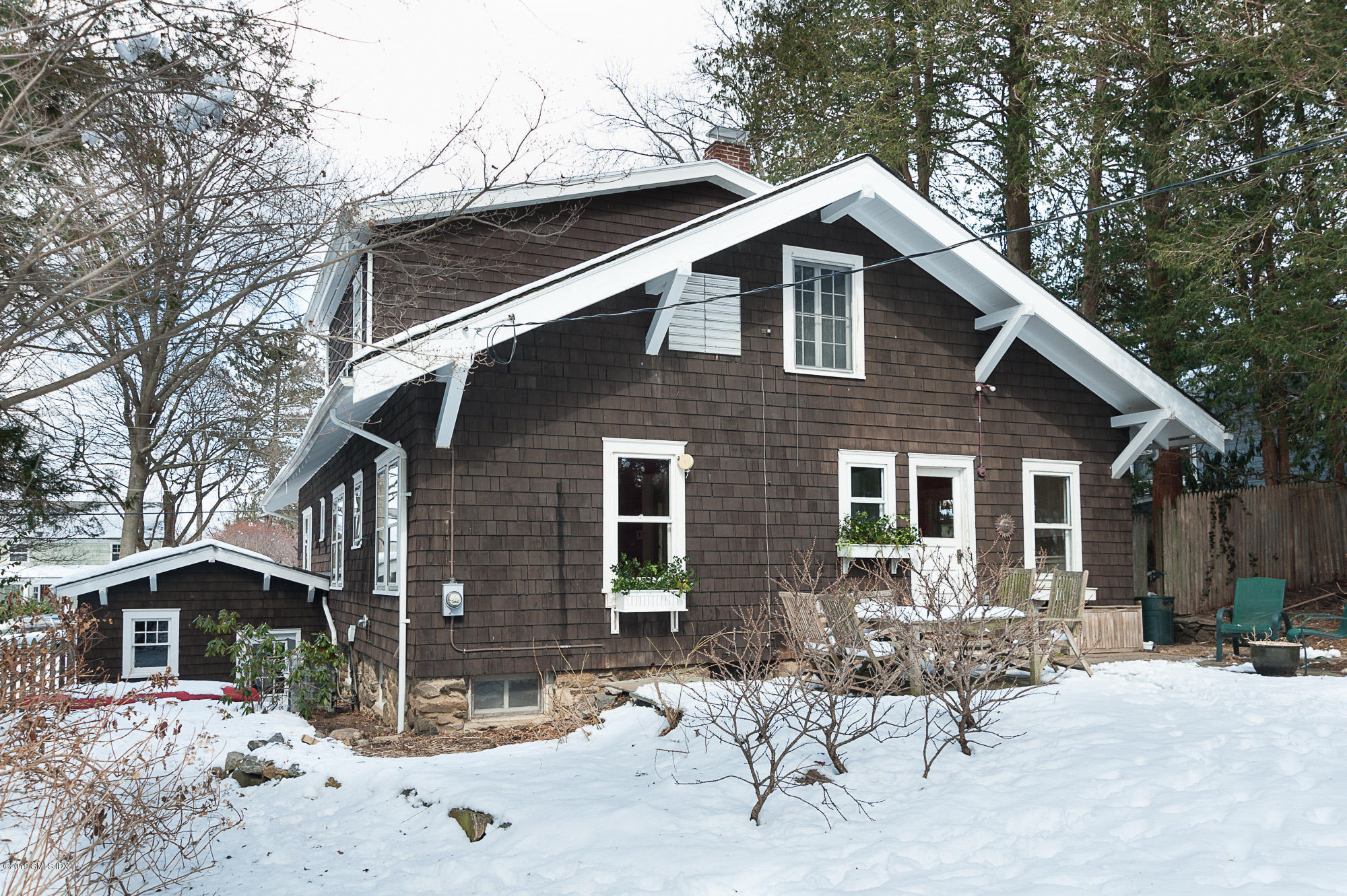28 Chapel Lane Riverside, CT 06878 - Photo 5 of 38 a front view of a house with a yard
