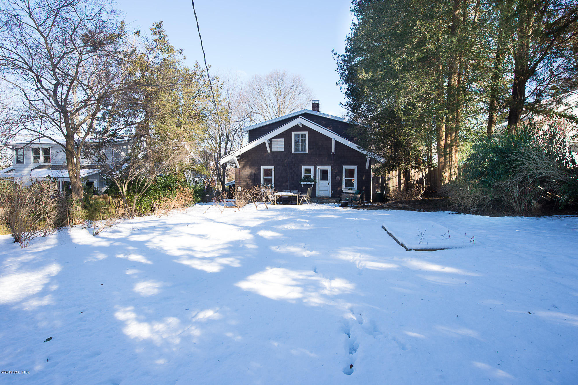 28 Chapel Lane Riverside, CT 06878 - Photo 7 of 38 a view of a large white house with a yard
