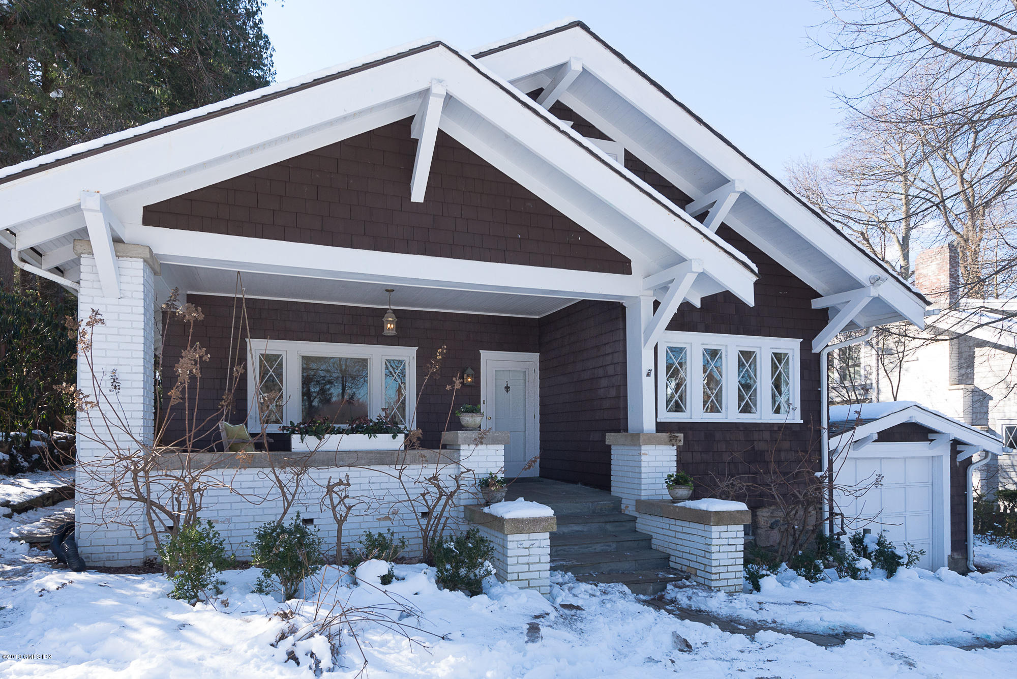 28 Chapel Lane Riverside, CT 06878 - Photo 9 of 38 a front view of a house with outdoor seating