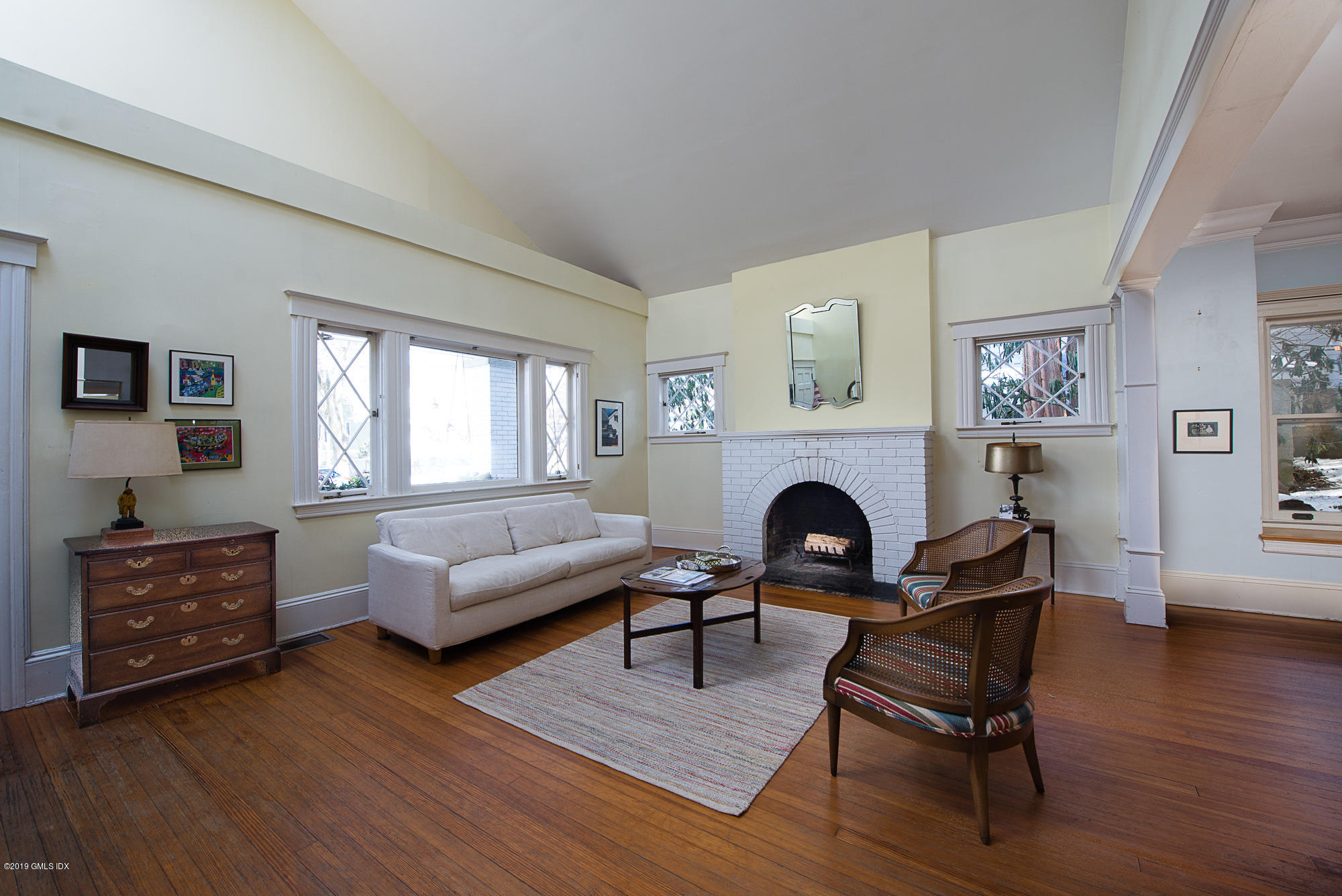 28 Chapel Lane Riverside, CT 06878 - Photo 10 of 38 a living room with furniture and a fireplace