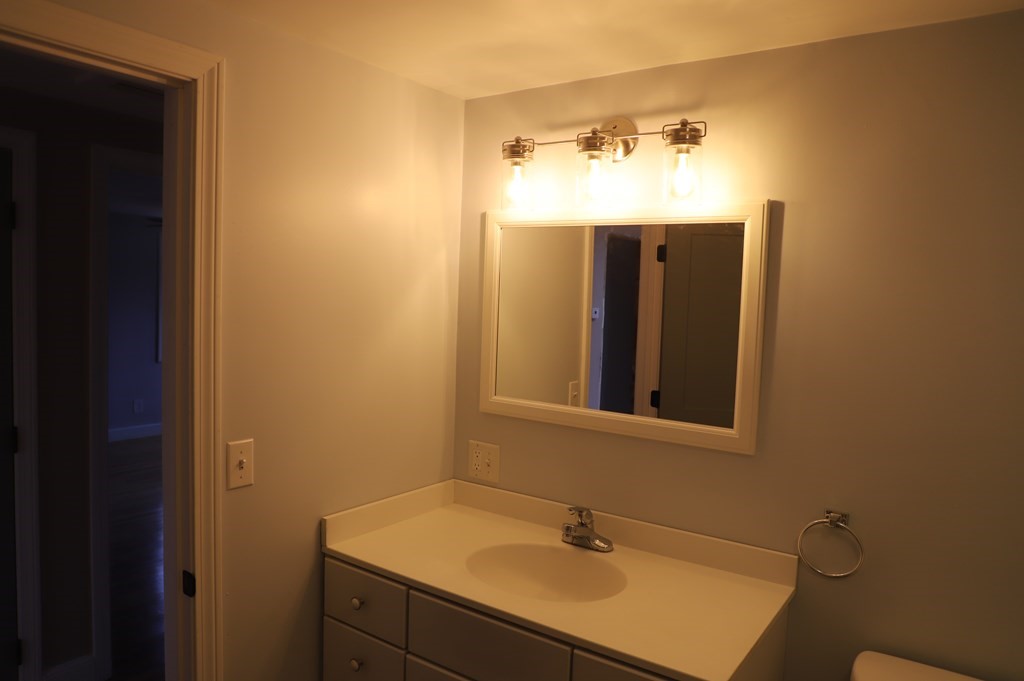 5 Hunt Road North Brookfield, MA 01535 - Photo 12 of 26 a bathroom with a sink and a mirror