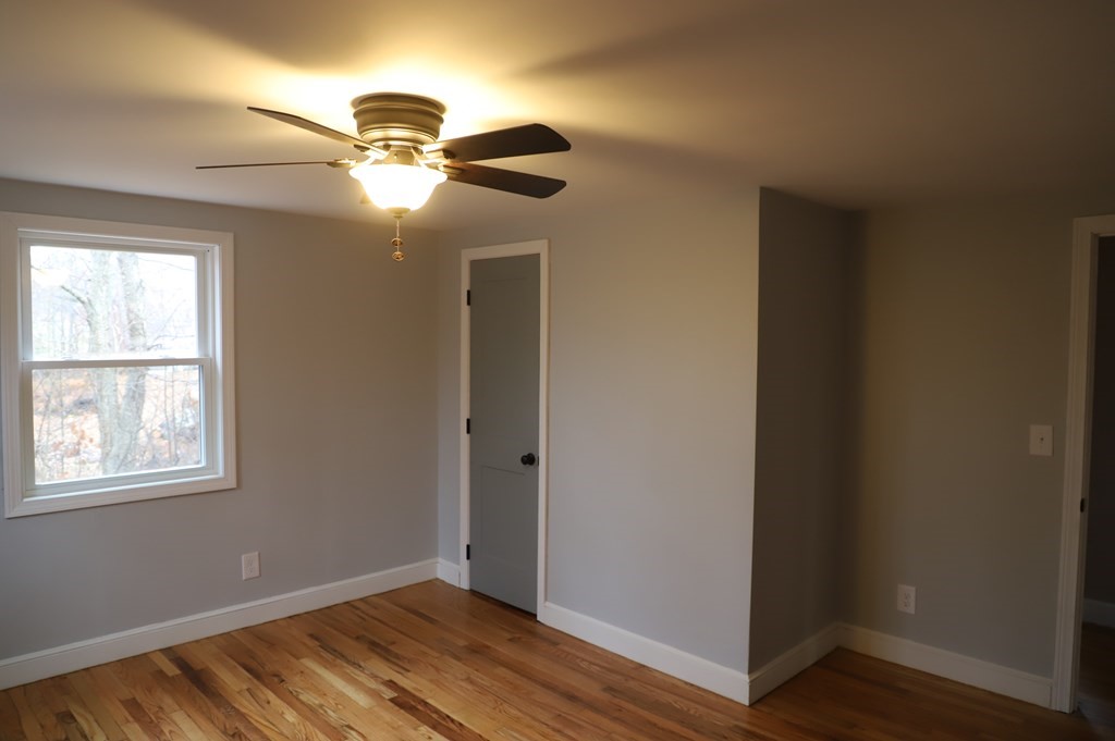5 Hunt Road North Brookfield, MA 01535 - Photo 14 of 26 a view of empty room with wooden floor and fan