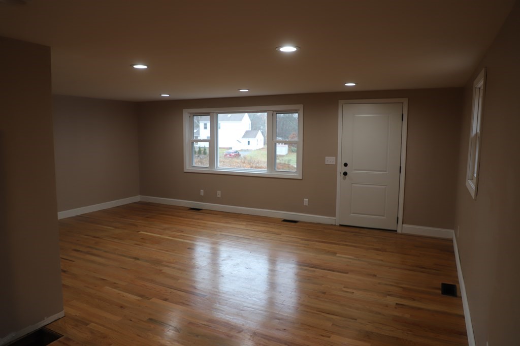 5 Hunt Road North Brookfield, MA 01535 - Photo 8 of 26 an empty room with wooden floor and windows