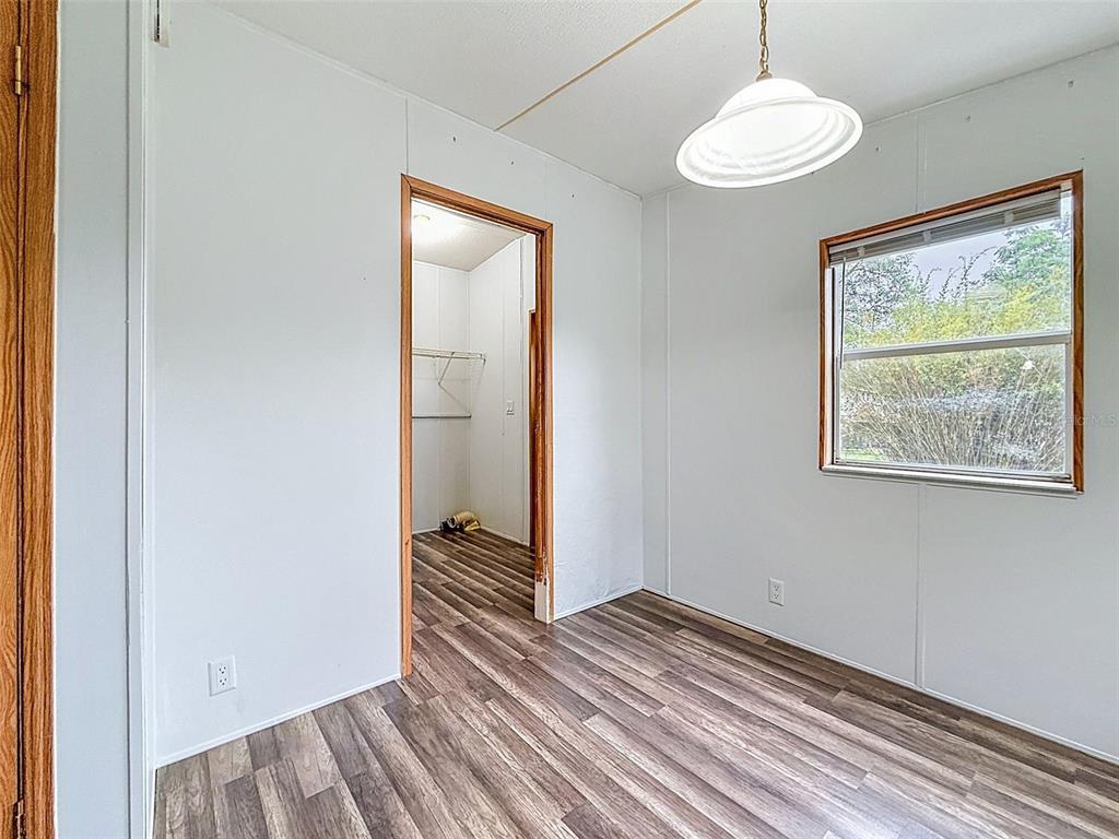 1819 Sinclair Hills Road Lutz, FL 33549 - Photo 52 of 60 a view of wooden floor and a window in a room