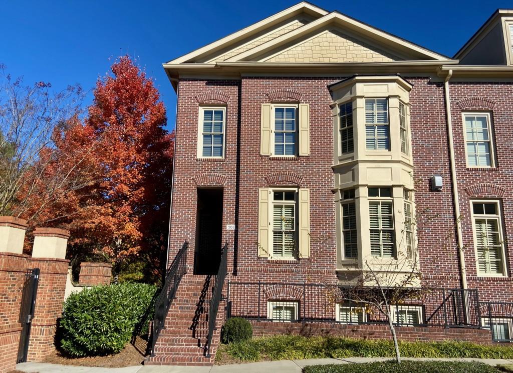 201 Riversgate Drive, Unit 37 Atlanta, GA 30339 - Photo 1 of 1 a front view of a house with garden