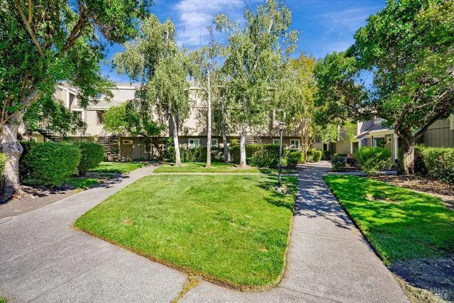 a view of balcony with wooden floor and fence