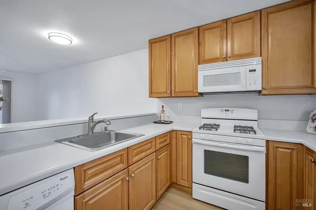 a kitchen with a stove and cabinets