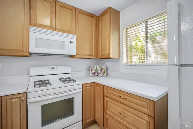 a kitchen with kitchen island a sink and cabinets