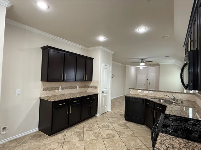 a bathroom with a double vanity sink and mirror with shower
