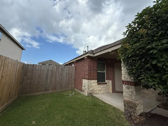 a backyard of a house with lots of green space