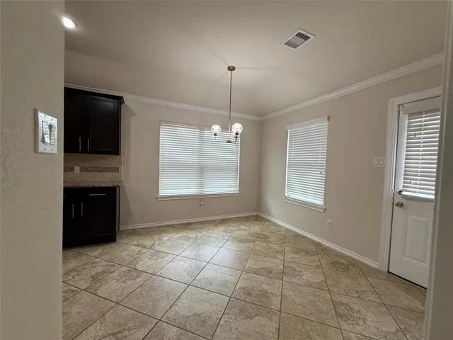 a view of a hallway with a bathroom