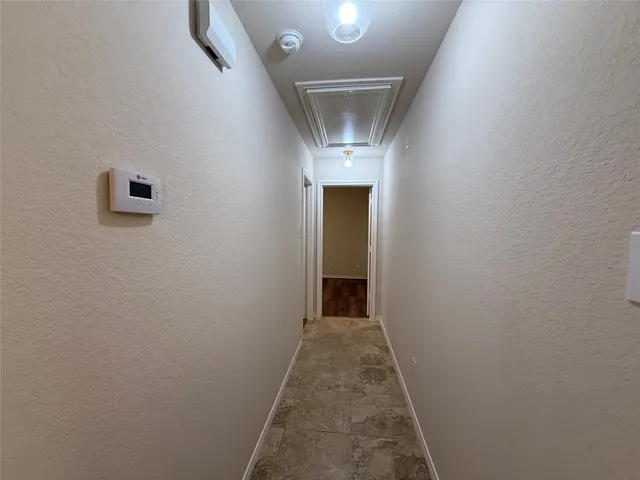 a bathroom with a toilet and a bathtub