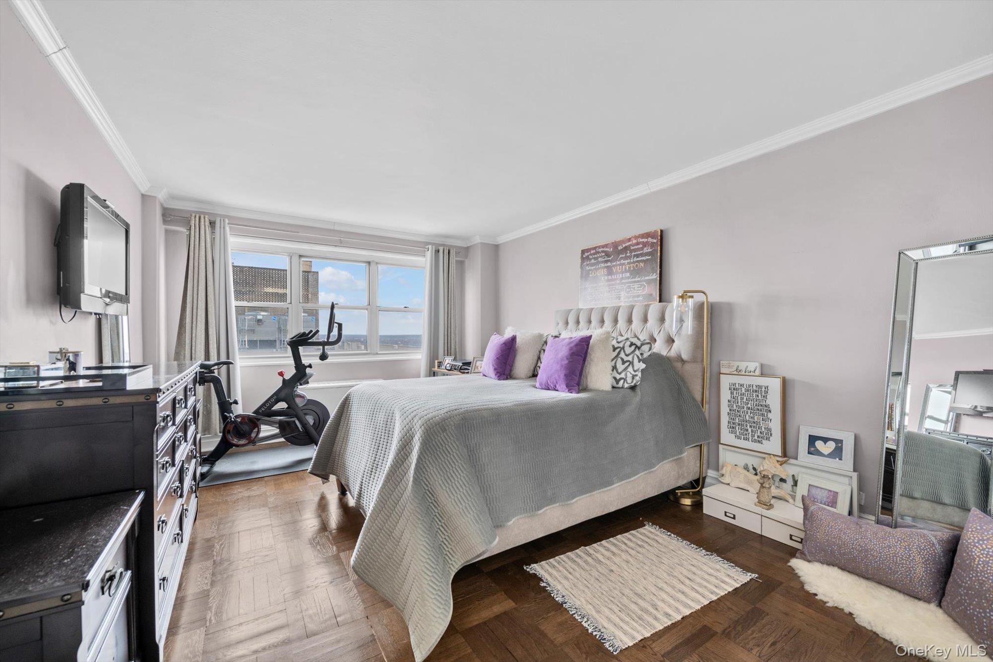 102-30 66th Road, Unit A28 Queens, NY 11375 - Photo 11 of 24 a bed room with a bed and a couch