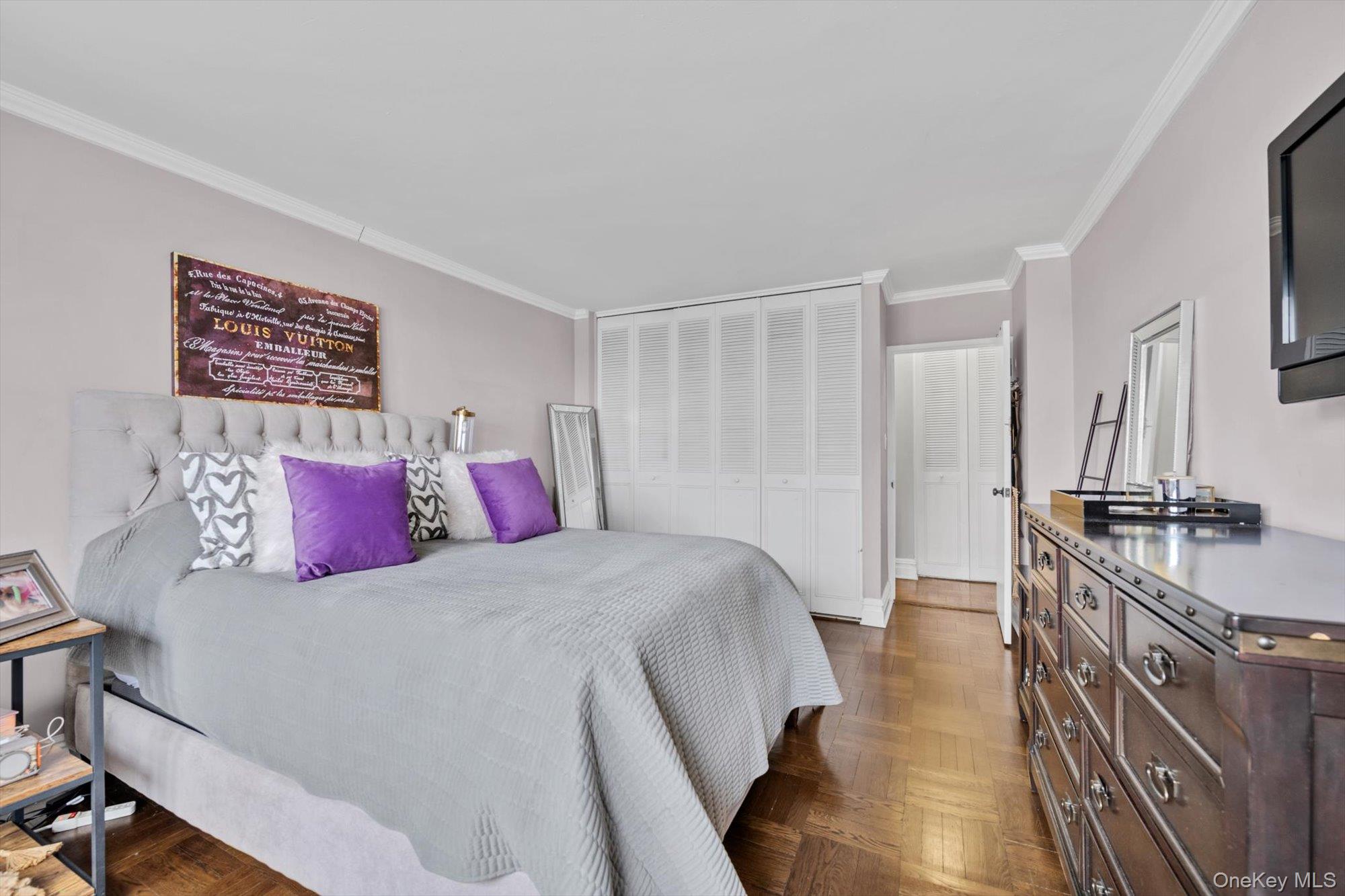 102-30 66th Road, Unit A28 Queens, NY 11375 - Photo 12 of 24 a bedroom with a bed and a table