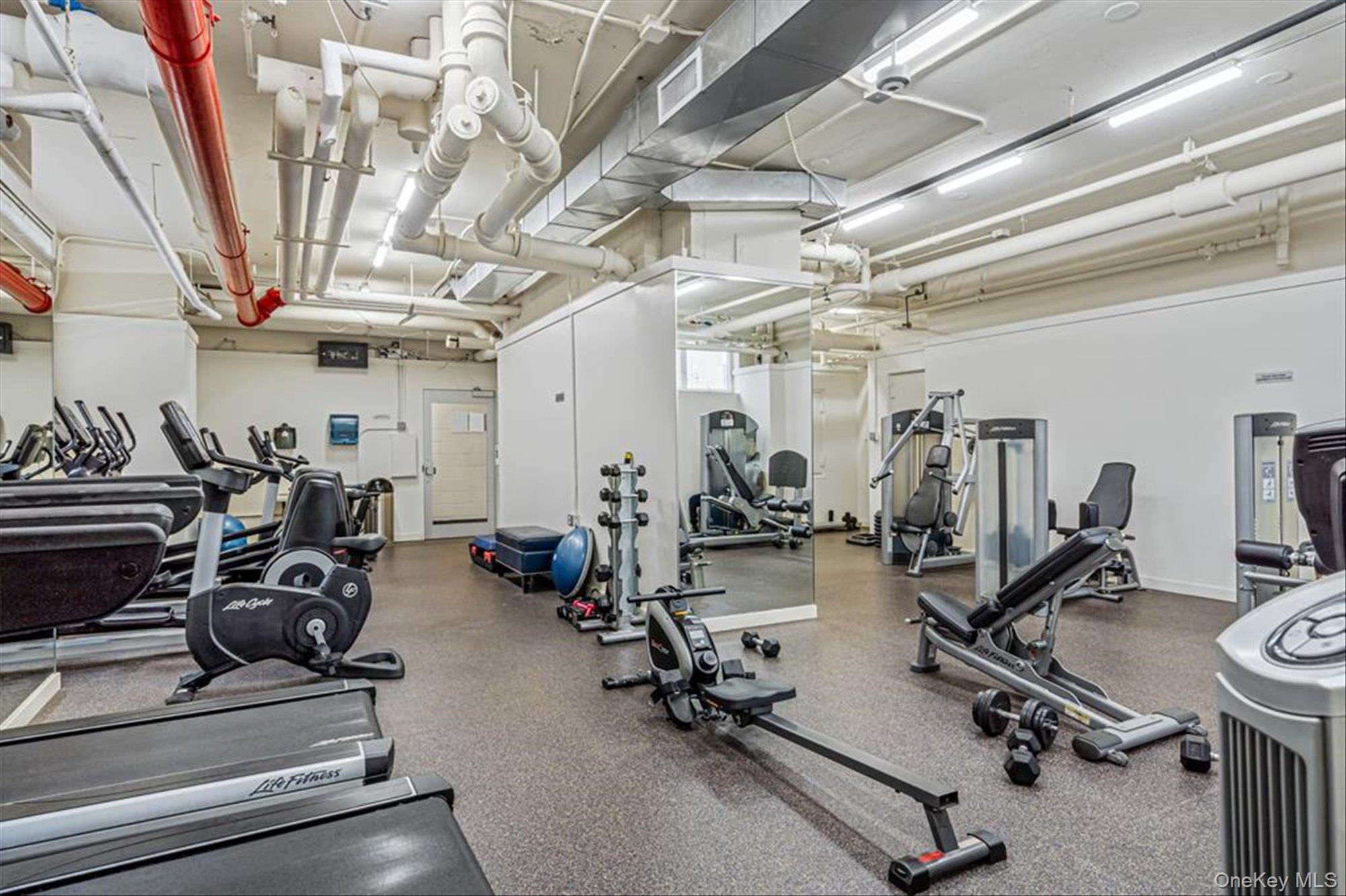 102-30 66th Road, Unit A28 Queens, NY 11375 - Photo 16 of 24 a view of a room with gym equipment