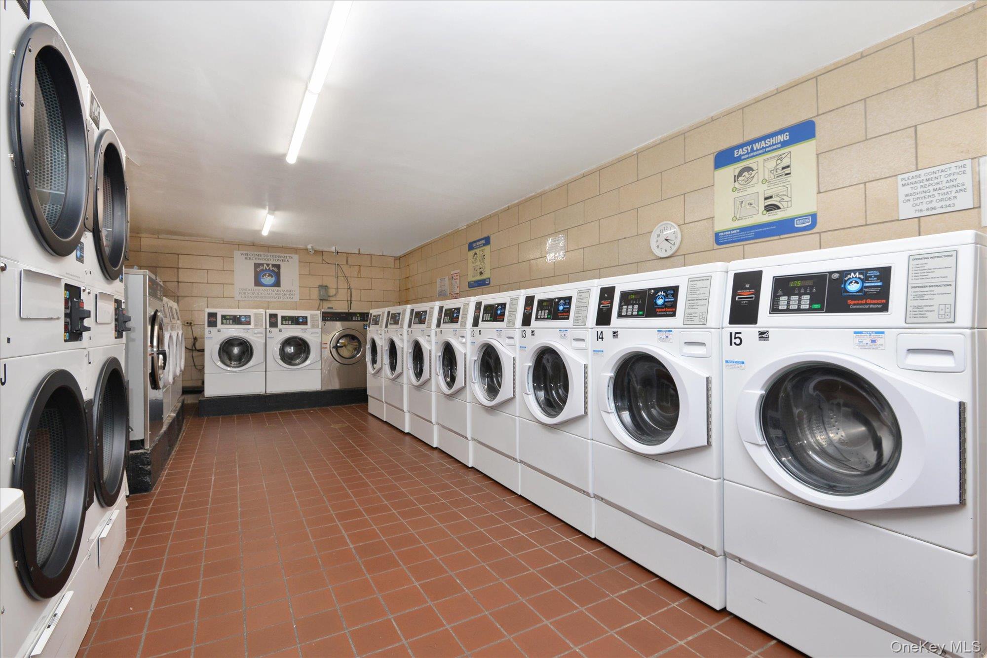 102-30 66th Road, Unit A28 Queens, NY 11375 - Photo 17 of 24 a utility room with dryer and washer