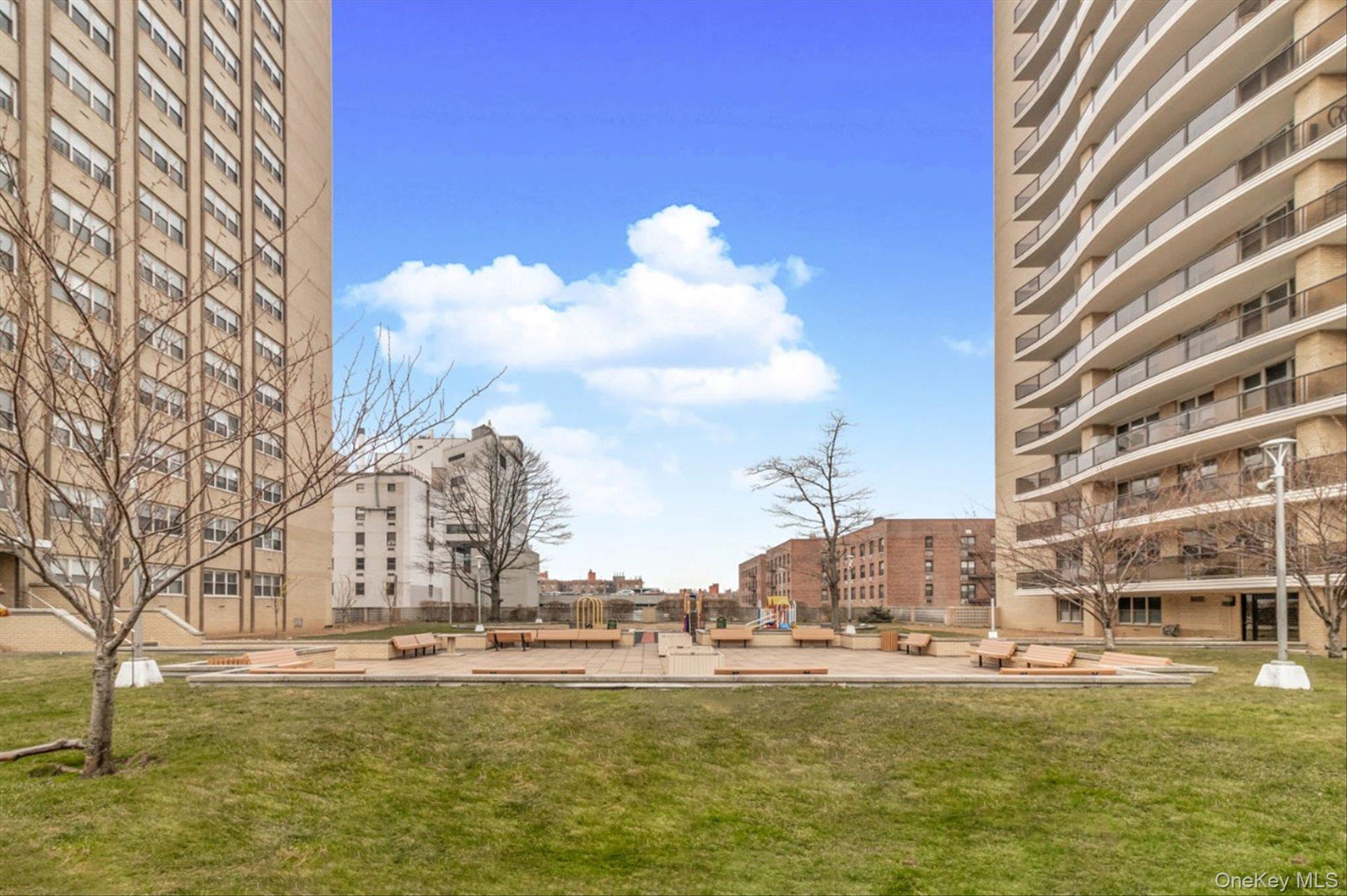 102-30 66th Road, Unit A28 Queens, NY 11375 - Photo 22 of 24 a view of a large building with a large pool