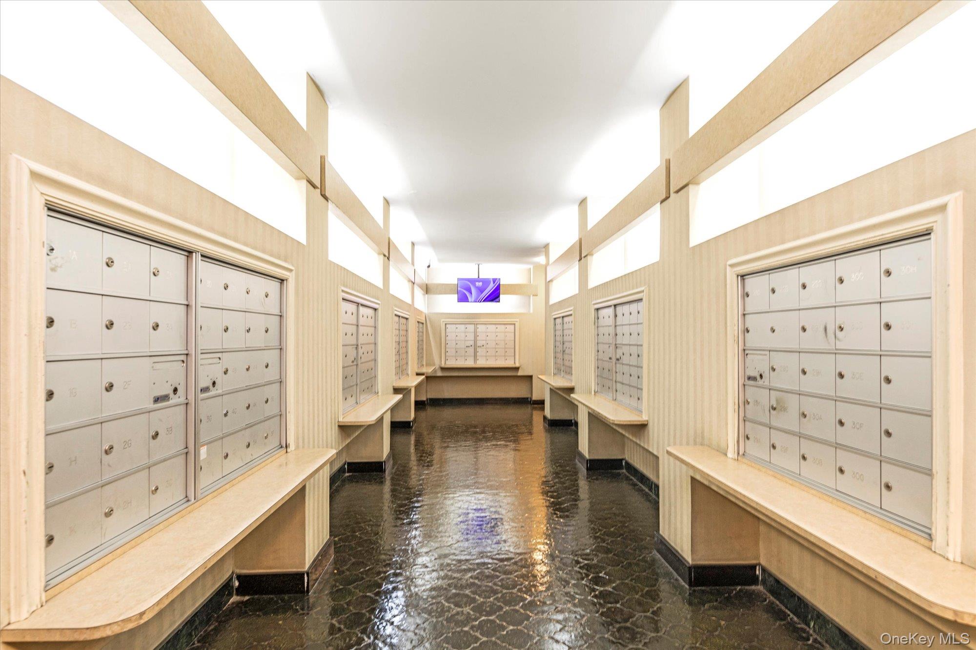 102-30 66th Road, Unit A28 Queens, NY 11375 - Photo 4 of 24 a view of walk in closet with clothes and shoes