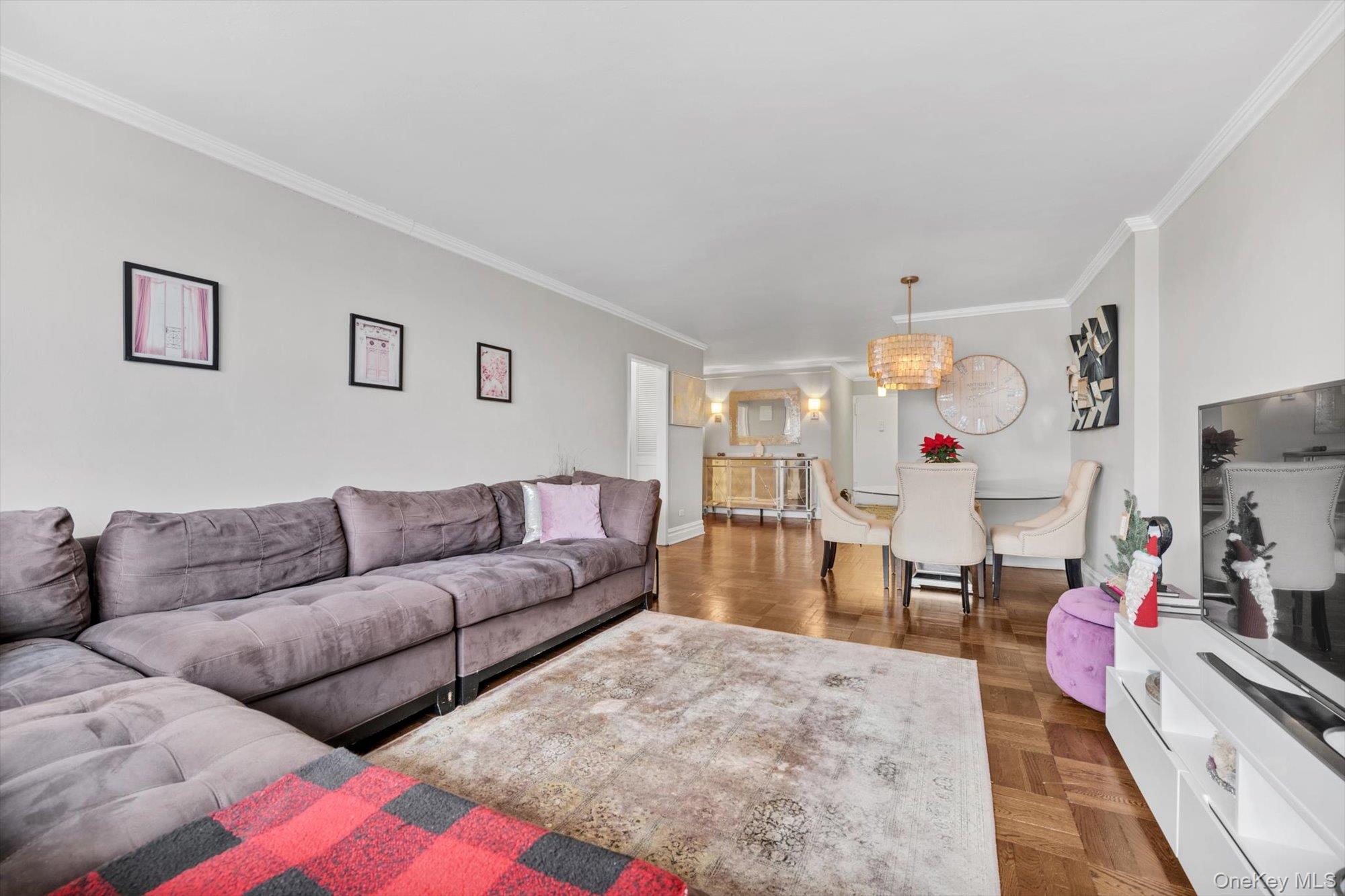 102-30 66th Road, Unit A28 Queens, NY 11375 - Photo 7 of 24 a living room with furniture and a couch