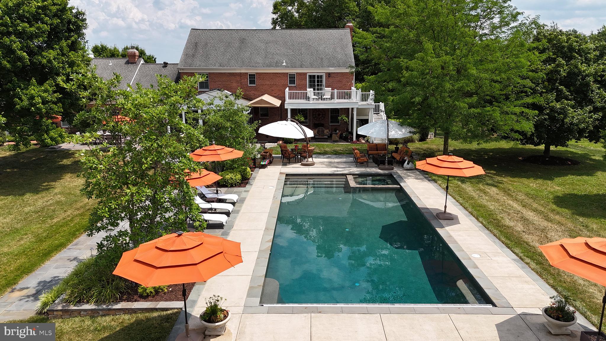26100 Mullinix Mill Road Mount Airy, MD 21771 - Photo 62 of 99 Serene oasis with vibrant poolside charm.