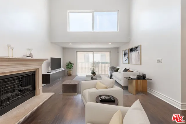 a living room with furniture or fireplace and a wooden floor