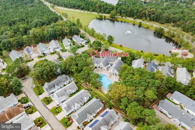 an aerial view of a house with a lake view