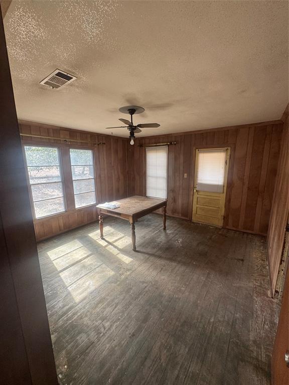 2980 Military Road Ringgold, LA 71068 - Photo 13 of 17 an empty room with windows and ceiling fan