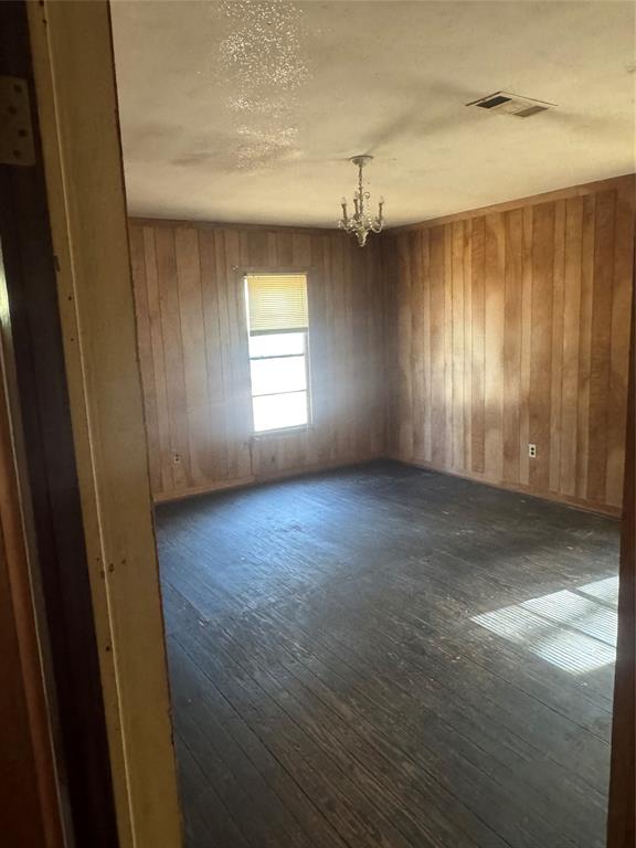 2980 Military Road Ringgold, LA 71068 - Photo 9 of 17 an empty room with wooden floor and windows