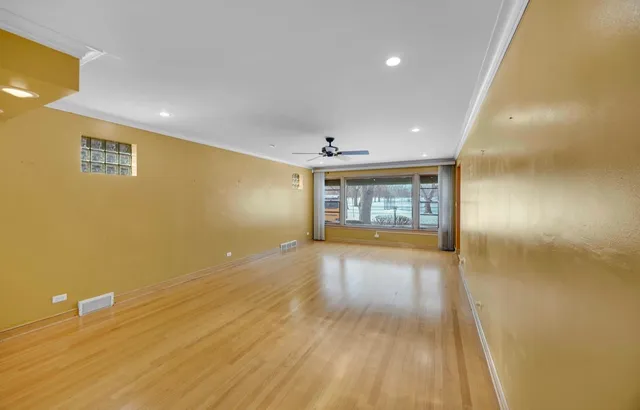 a view of an empty room and a window