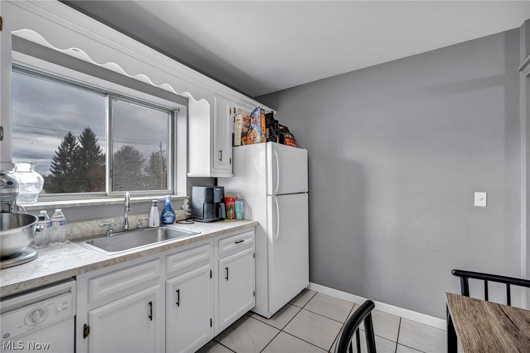 5200 Royalton Road, Unit 9B North Royalton, OH 44133 - Photo 11 of 27 Kitchen with light countertops, white appliances, and white cabinetry
