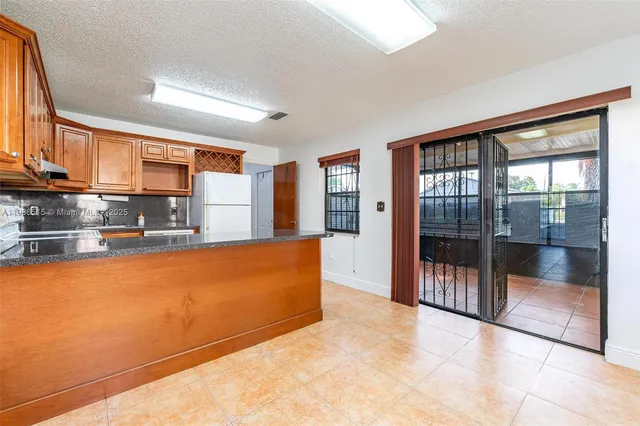 a view of an empty room with a sliding door