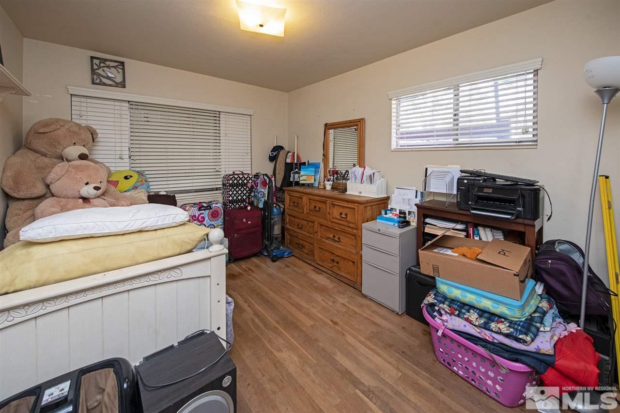 415 West Arroyo Street Reno, NV 89509 - Photo 25 of 33 a bedroom with furniture and a window