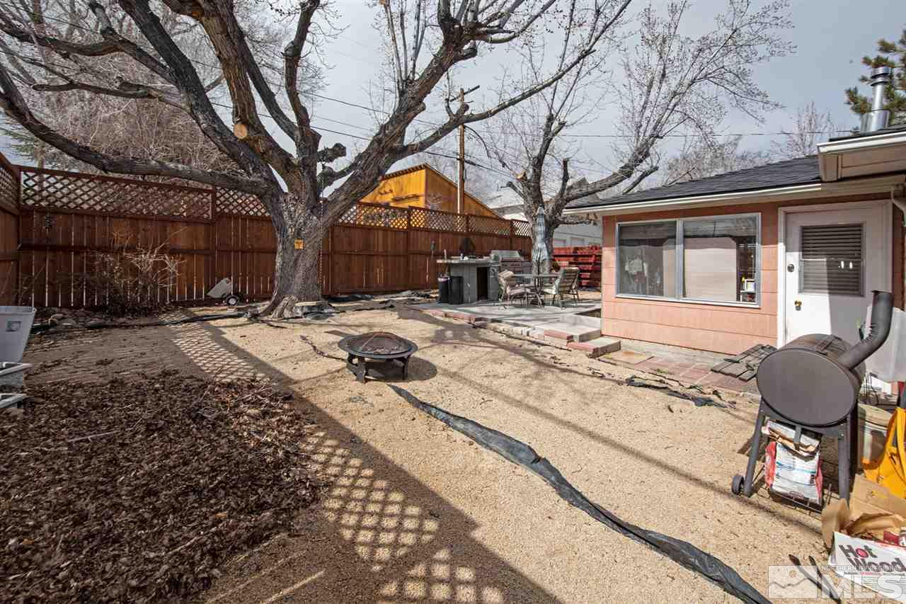415 West Arroyo Street Reno, NV 89509 - Photo 29 of 33 a row of palm trees in front of house