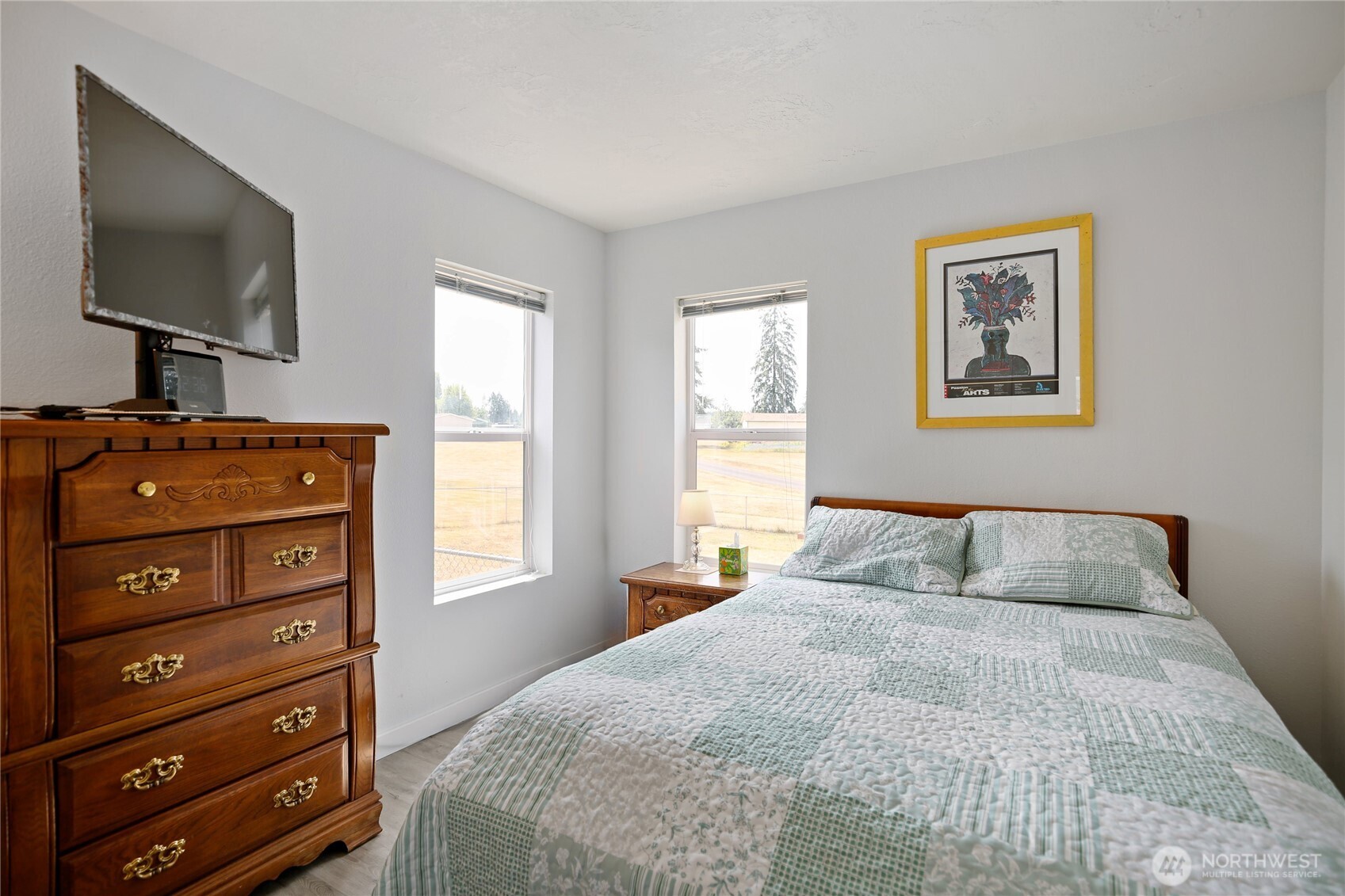 270 Romerman Road, Unit 34 Chehalis, WA 98532 - Photo 14 of 34 a bedroom with a bed and a flat tv screen on a dresser