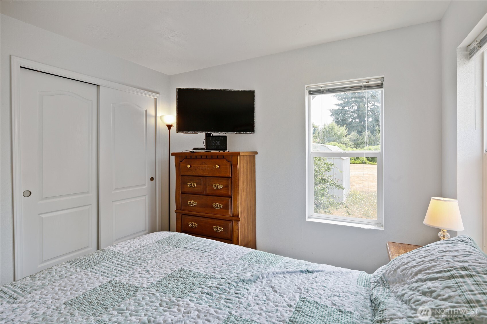 270 Romerman Road, Unit 34 Chehalis, WA 98532 - Photo 15 of 34 a bedroom with a bed and a flat screen tv